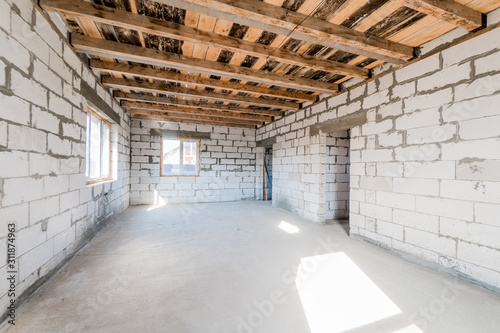 Russia, Moscow- August 05, 2019: interior room rough repair for self-finishing. interior decoration, bare walls of the room, stage of construction © evgeniykleymenov