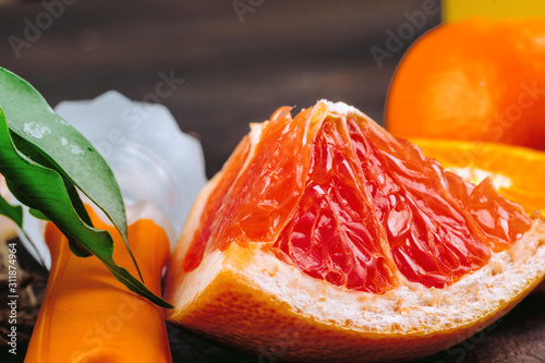 Sliced into pieces juicy ripe oranges close up
