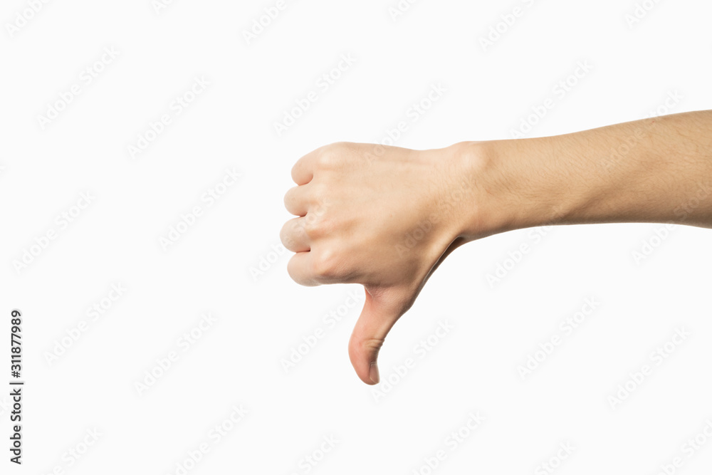 Hand of man showing thumb-down gesture on white background Hand of man showing thumb-down gesture on white background