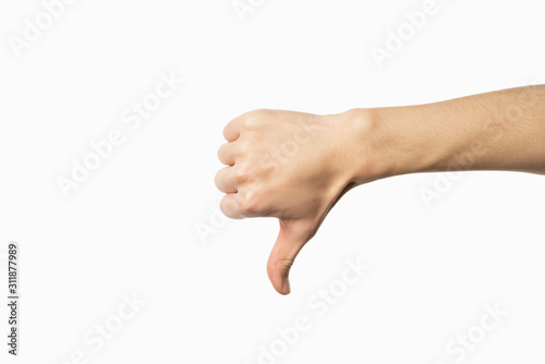 Hand of man showing thumb-down gesture on white background photo