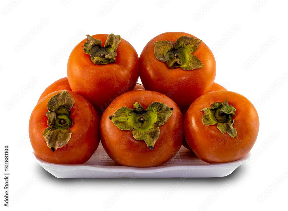 Fresh persimmons in a market plate, isolated on white background Fresh persimmons in a market plate, isolated on white background