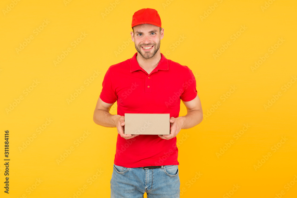 Man red cap yellow background. Delivering purchase. Faster than you can imagine. Delivered to your destination. Service delivery. Salesman career. Courier and delivery. Postman delivery worker