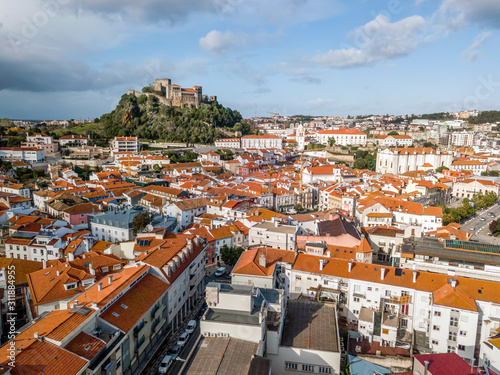 Aerial view of Leiria with red roofs and castle on the hill, Portugal photo