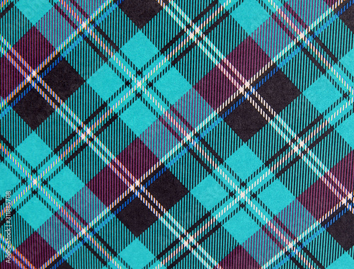 Plaid background pattern in turquoise and purple with black, white and blue