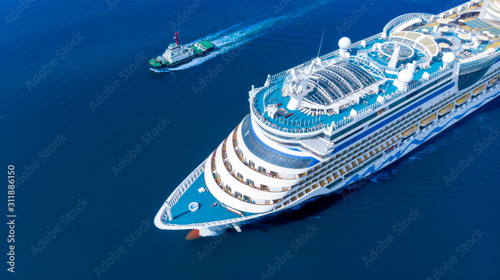 Aerial view of beautiful white cruise ship above luxury cruise running with tug boat in the ocean sea  concept tourism travel on holiday take a vacation time on summer.  forwarder mast - obrazy, fototapety, plakaty 