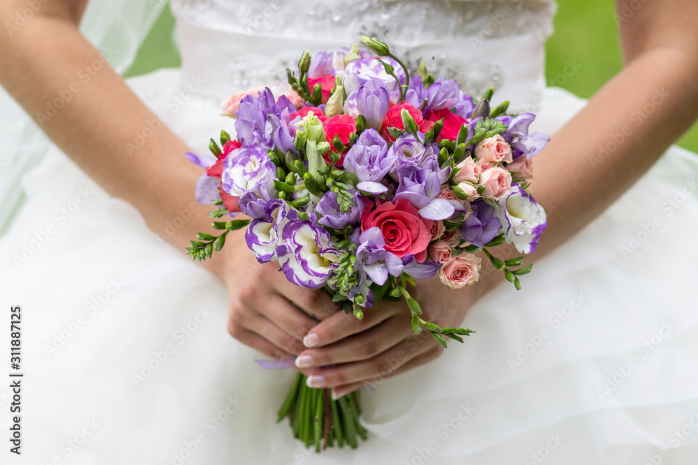 wedding bouquet of flowers in the hands of the bride, wedding wedding bouquet of flowers in the hands of the bride, wedding