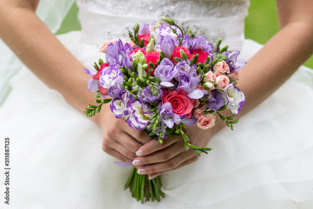 wedding bouquet of flowers in the hands of the bride, wedding