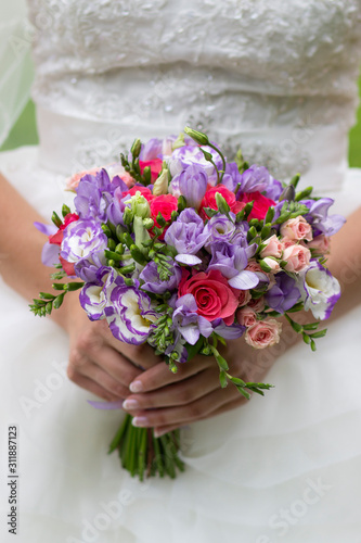 Fototapeta Naklejka Na Ścianę i Meble -  wedding bouquet of flowers in the hands of the bride, wedding