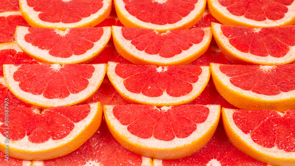 Grapefruit red juicy slices background. top view. Grapefruit red juicy slices background. top view.