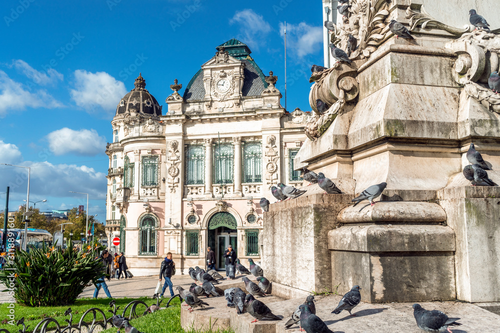 Pigeons in front of Bank of Portugal building, Coimbra, Portugal