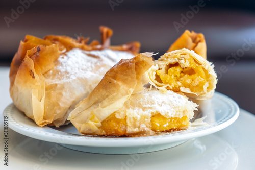 Delicious portuguese traditional pastry from Coimbra on white plate