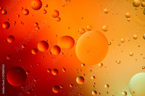 abstract orange and red color background from mixed water and oil