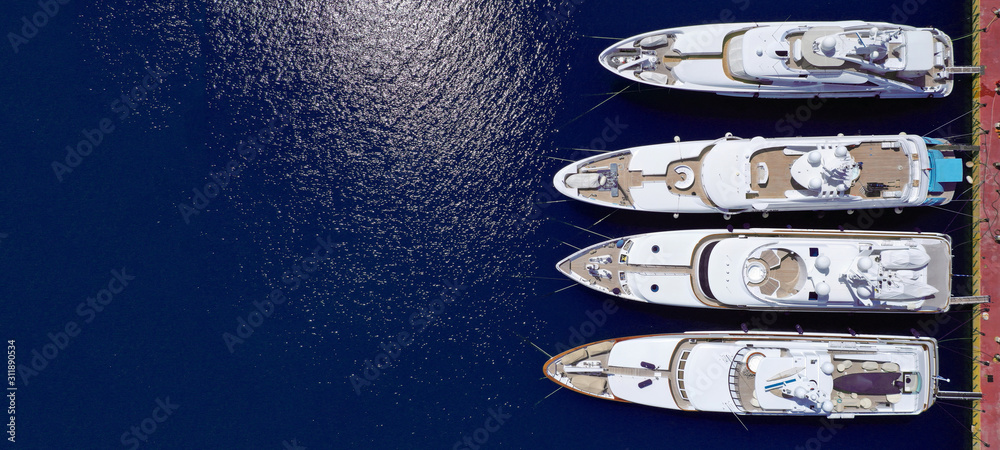 Aerial drone top down ultra wide photo of Mediterranean port with yachts docked