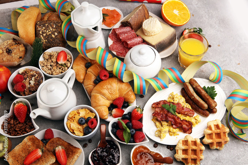 Breakfast served with coffee, orange juice, croissants, cereals and fruits. Balanced diet. Continental breakfast on carnival or new year