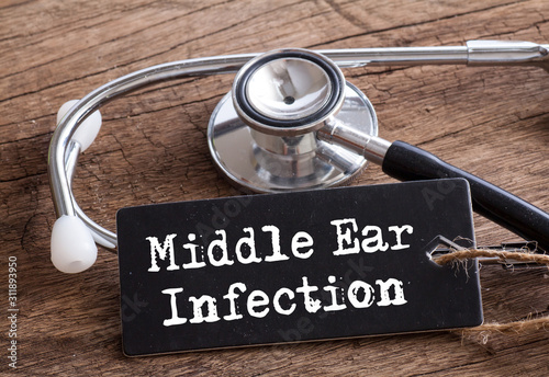 Fotografie Stethoscope on wood with Middle Ear Infection words as medical concept