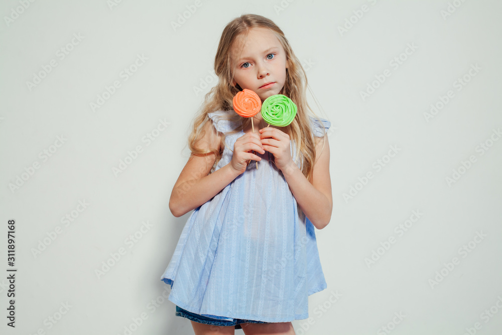 beautiful little girl blonde with cake and candy portrait of food beautiful little girl blonde with cake and candy portrait of food