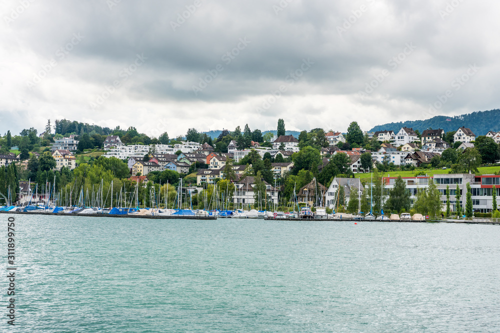 Beautiful buildings on the hills and on the lakeshore of Lake of Zurich, Switzerland.