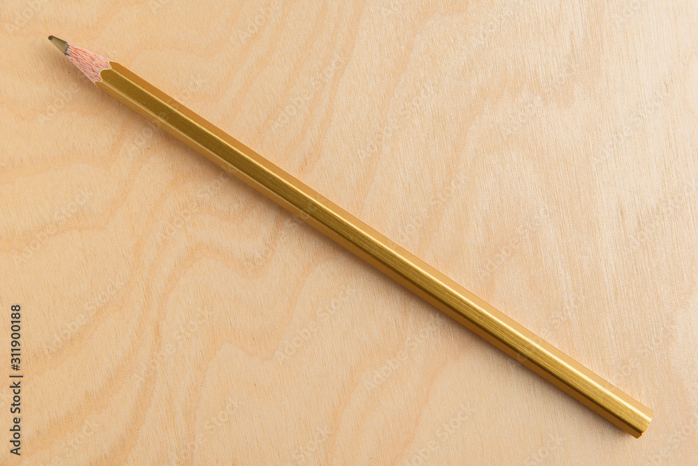 Gold Color Pencil Isolated On Wood Background Gold Color Pencil Isolated On Wood Background