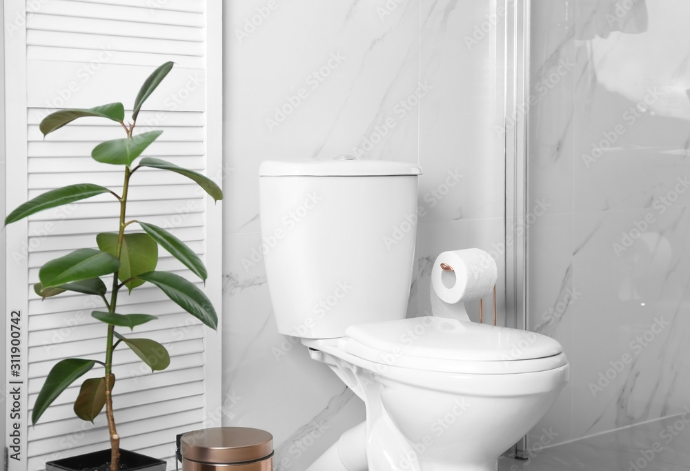 Fototapeta premium Ceramic toilet bowl in modern bathroom interior