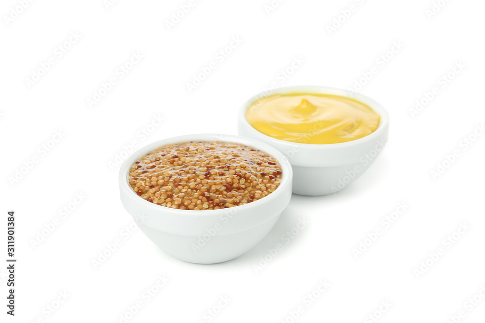 Bowls with tasty mustard isolated on white background Bowls with tasty mustard isolated on white background