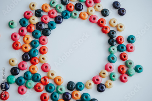 colorful beads on a white background and circle copyspace