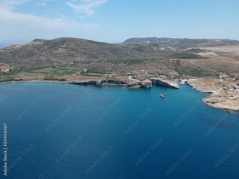 Milos, Greece Papafragas Beach and Caves view from the drone with visitors at sunny weather