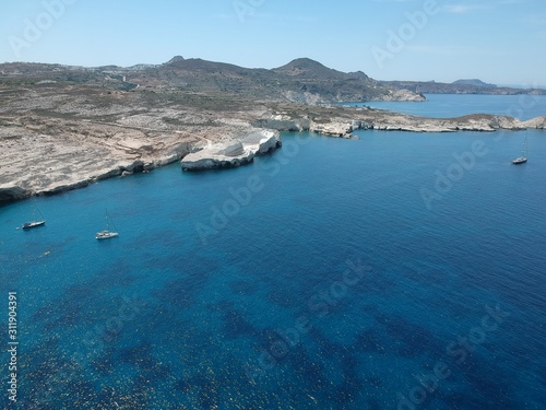 Milos, Greece Papafragas Beach and Caves view from the drone with visitors at sunny weather © STUDIO MELANGE