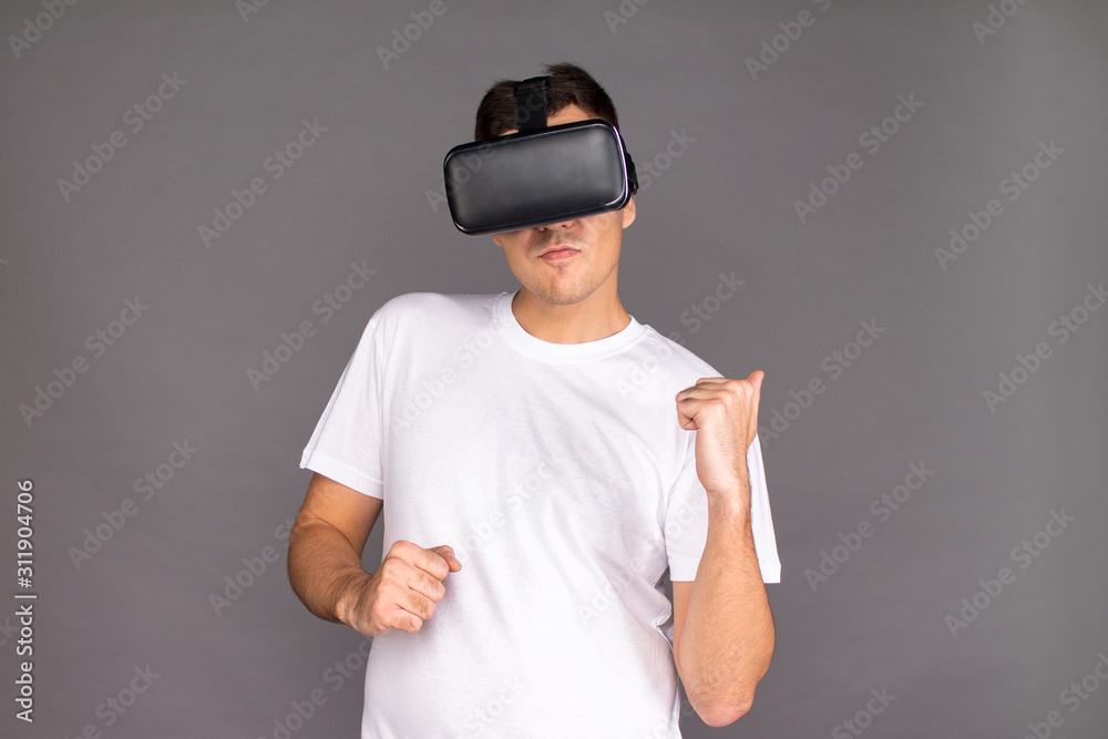 A guy in virtual reality glasses is dancing. Future and modern technologies