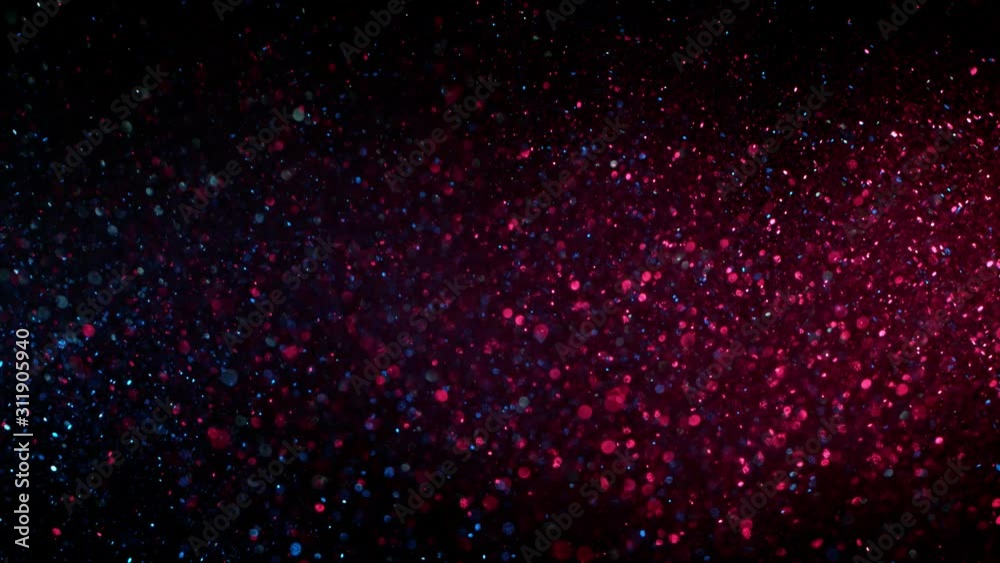 Super slow motion of sparkling abstract glittering background in neon colours. Filmed on very high speed camera, 1000 fps. Super slow motion of sparkling abstract glittering background in neon colours. Filmed on very high speed camera, 1000 fps.