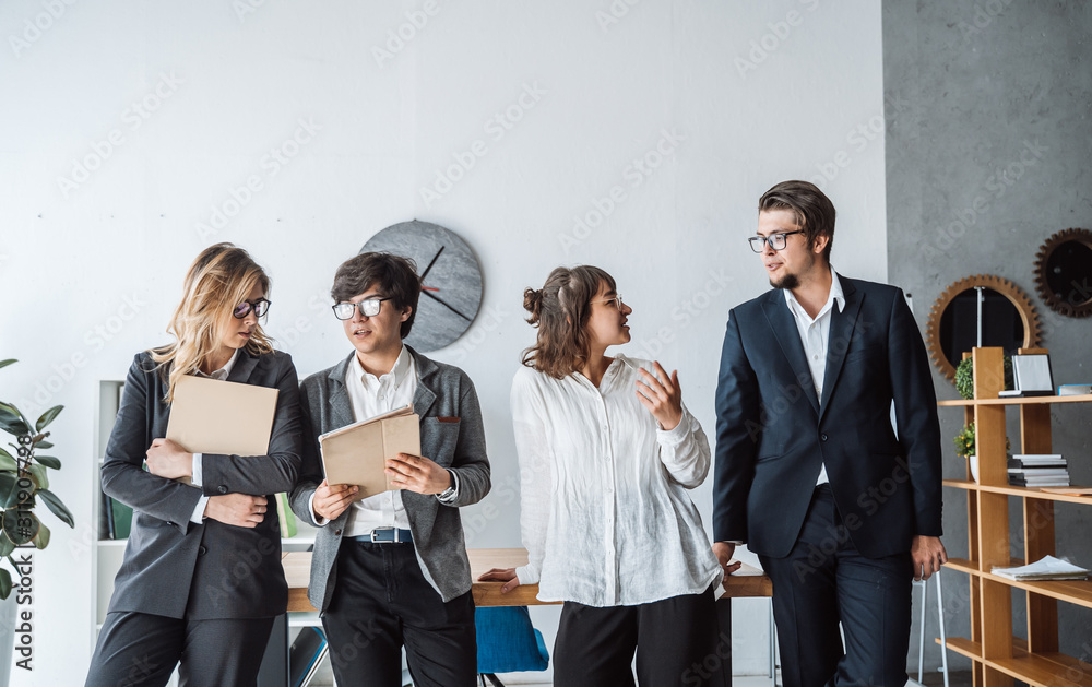 Business People standing in the office discuss Business People standing in the office discuss