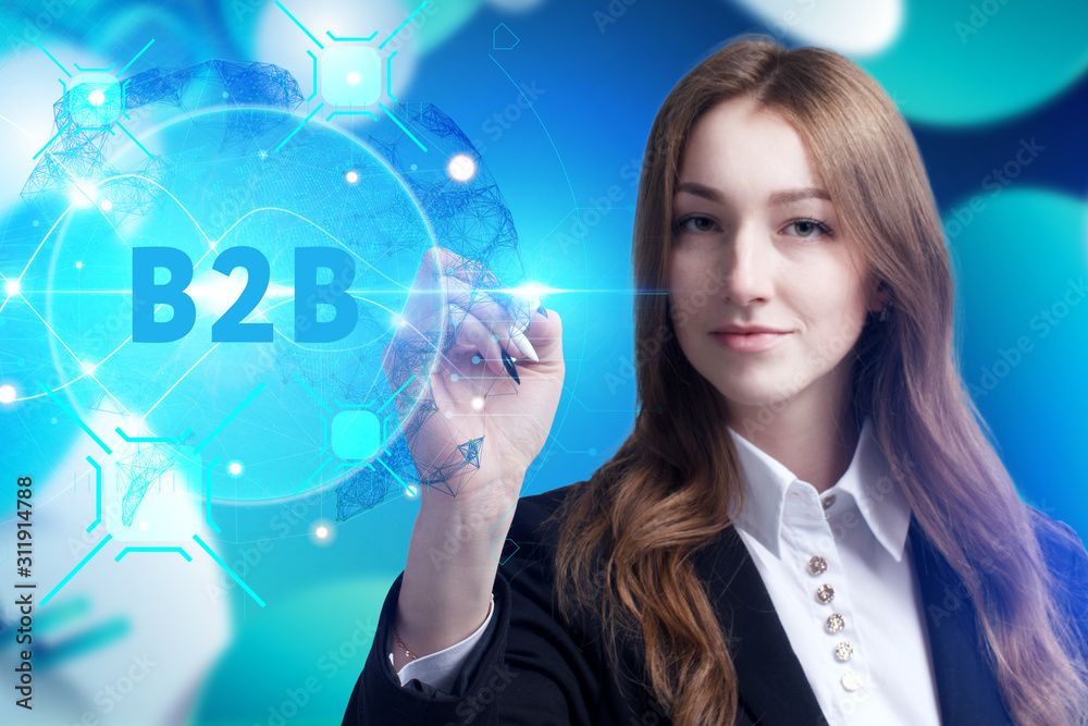 Business, Technology, Internet and network concept. Young businessman working on a virtual screen of the future and sees the inscription: B2B Business, Technology, Internet and network concept. Young businessman working on a virtual screen of the future and sees the inscription: B2B