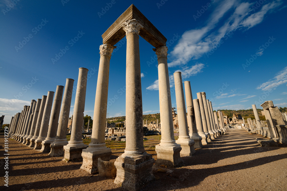 Fototapeta premium Corner pillars with lintel of Agora ruins at ancient Perge archaeological site Turkey