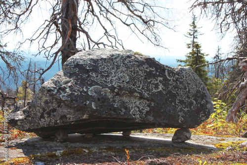 Large megalithic seid stone boulder in the nature reserve on mountain Vottovaara, Karelia, Russia photo