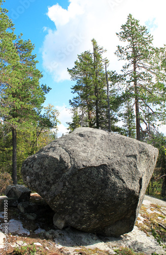 Large megalithic seid stone boulder in the nature reserve on mountain Vottovaara, Karelia, Russia