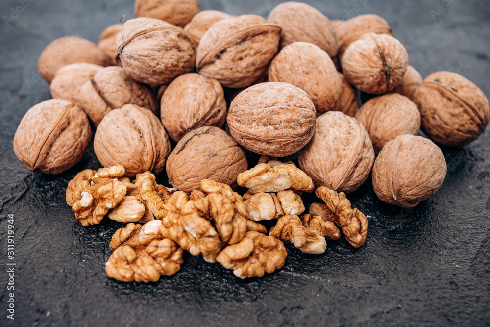 Walnuts on black background are ready to eat. Walnuts on black background are ready to eat.