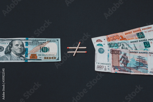 Dollars and Russian rubles on black background