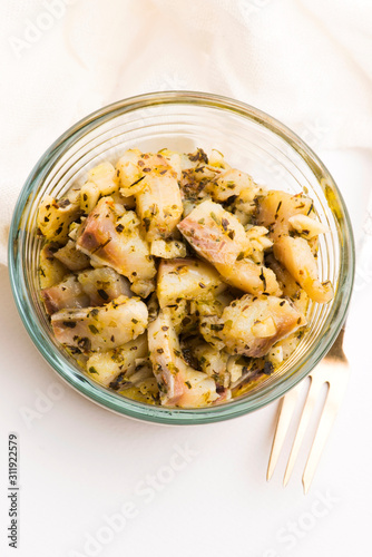 Herring salad with garlic, herbs and olive oil