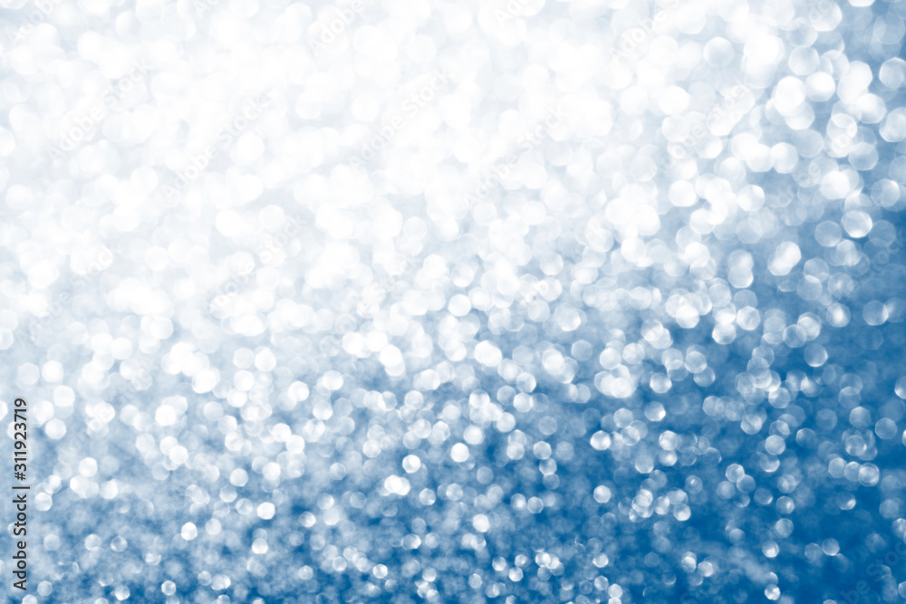 Bokeh, defocus background. Glare bokeh passing from silver to classic blue. Festive background. Copy space Bokeh, defocus background. Glare bokeh passing from silver to classic blue. Festive background. Copy space