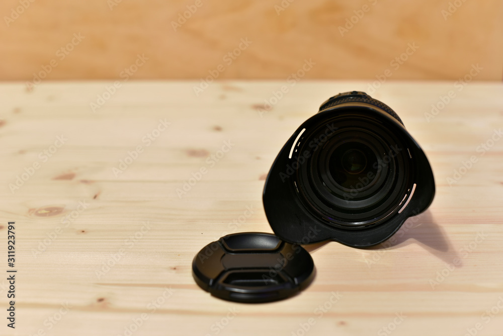 Photography Lenses on Wooden Table