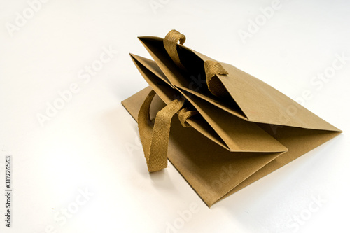 Beige paper bag for products. Isolated.