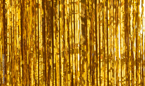 Party Background. Decor made of gold foil, tinsel and candy. Festive and cheerful mood