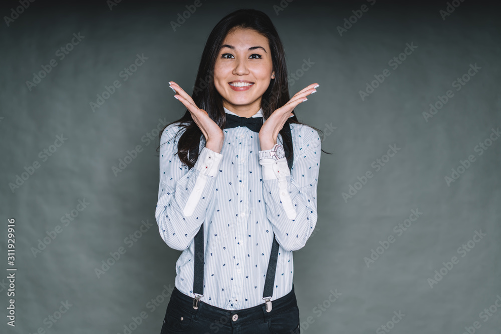 Cheerful woman with spread hands near face Cheerful woman with spread hands near face