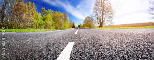 Road panorama background on sunny spring day photo