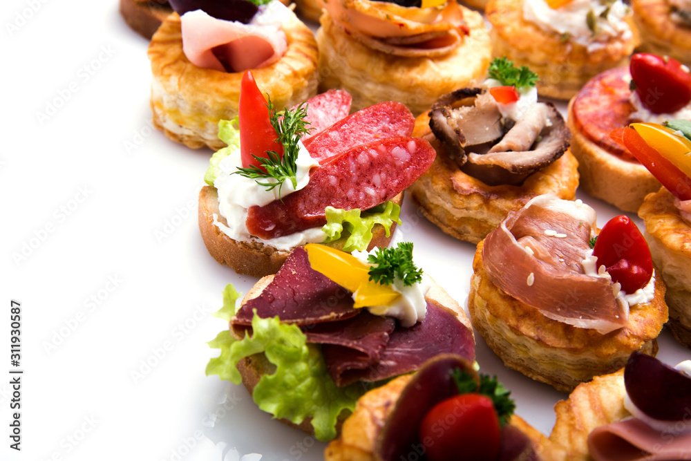 Many different canapes on a white background Many different canapes on a white background