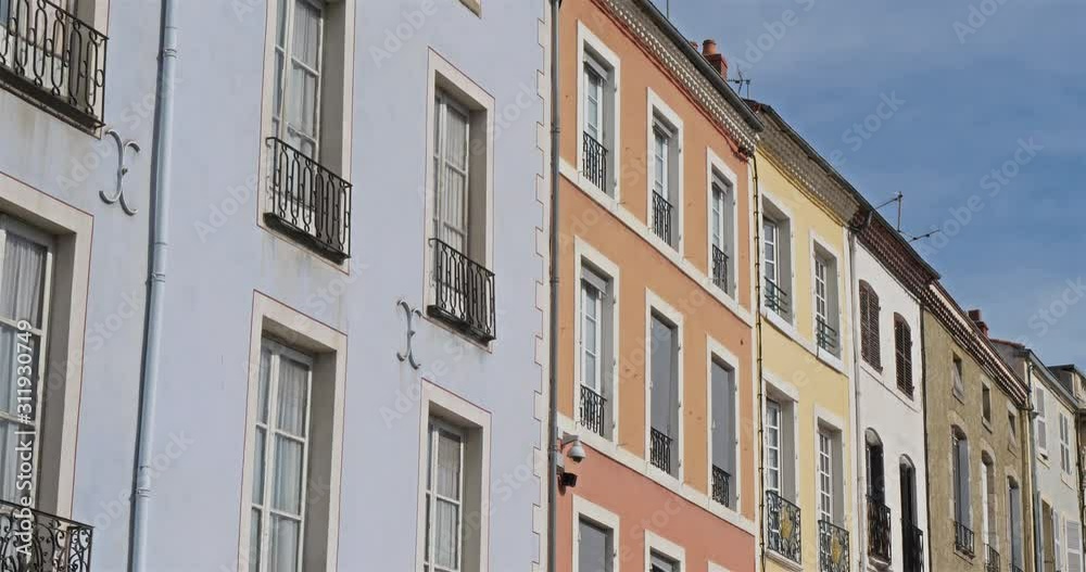 Issoire, Puy de Döme, Auvergne, France. Colored facades ,place de la republique. On the right side is the horloge tower. Issoire, Puy de Döme, Auvergne, France. Colored facades ,place de la republique. On the right side is the horloge tower.
