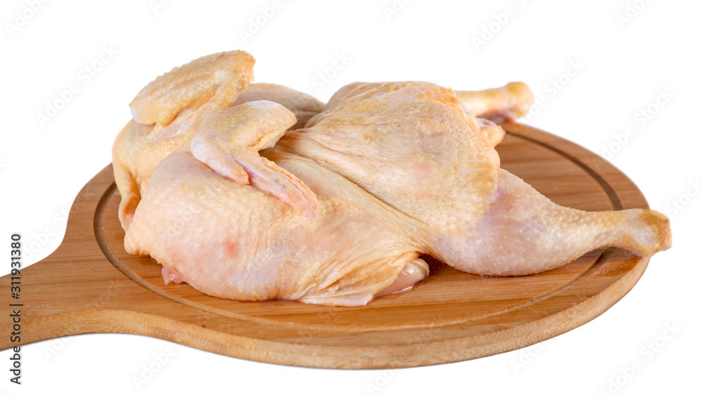 whole raw chicken on wooden cutting board isolated on white background whole raw chicken on wooden cutting board isolated on white background