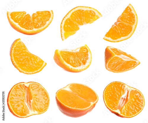 Set of cut fresh juicy tangerines on white background