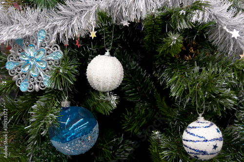 Christmas background - white ball, blue ball, tinsel on a Christmas tree - design blank - white and blue style