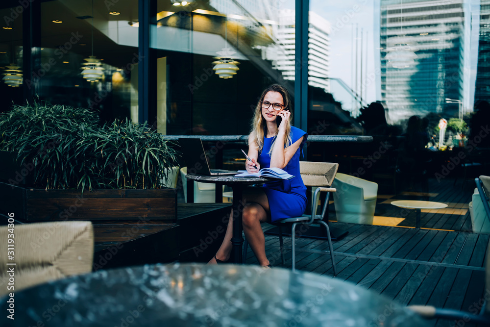 Fototapeta premium Business woman talking to coworker in office space