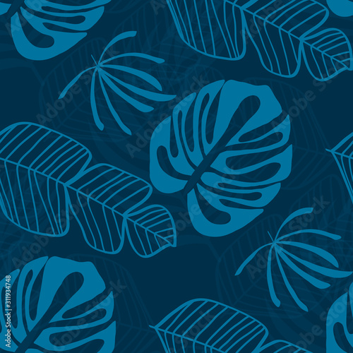 Tropical pattern with white leaves of monstera, banana and palm trees on a blue background. Exotic seamless pattern.